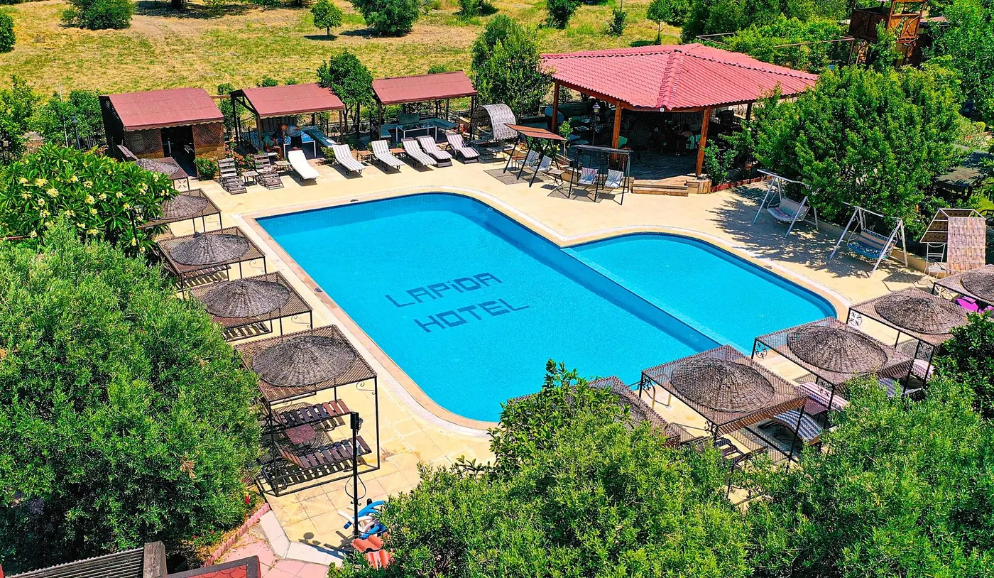 The Lapida pool from above with shaded loungers