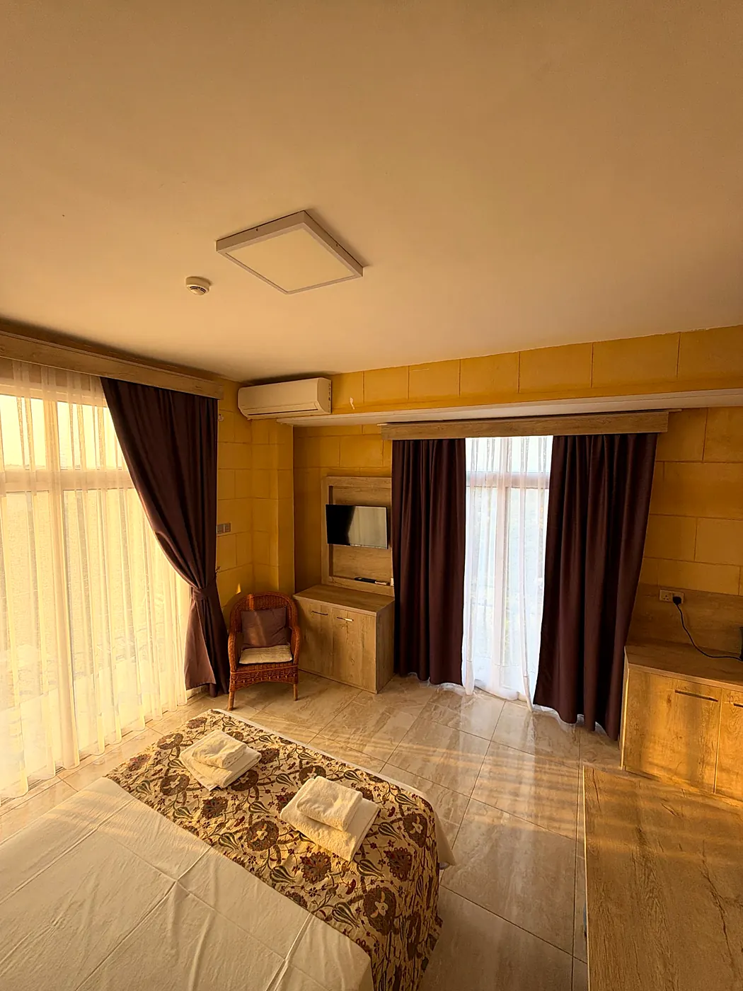 Room with sheer curtains in the late afternoon light